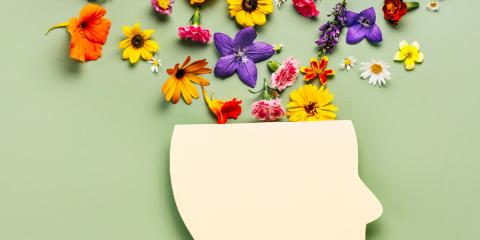 flowers coming out of a paper cut-out head